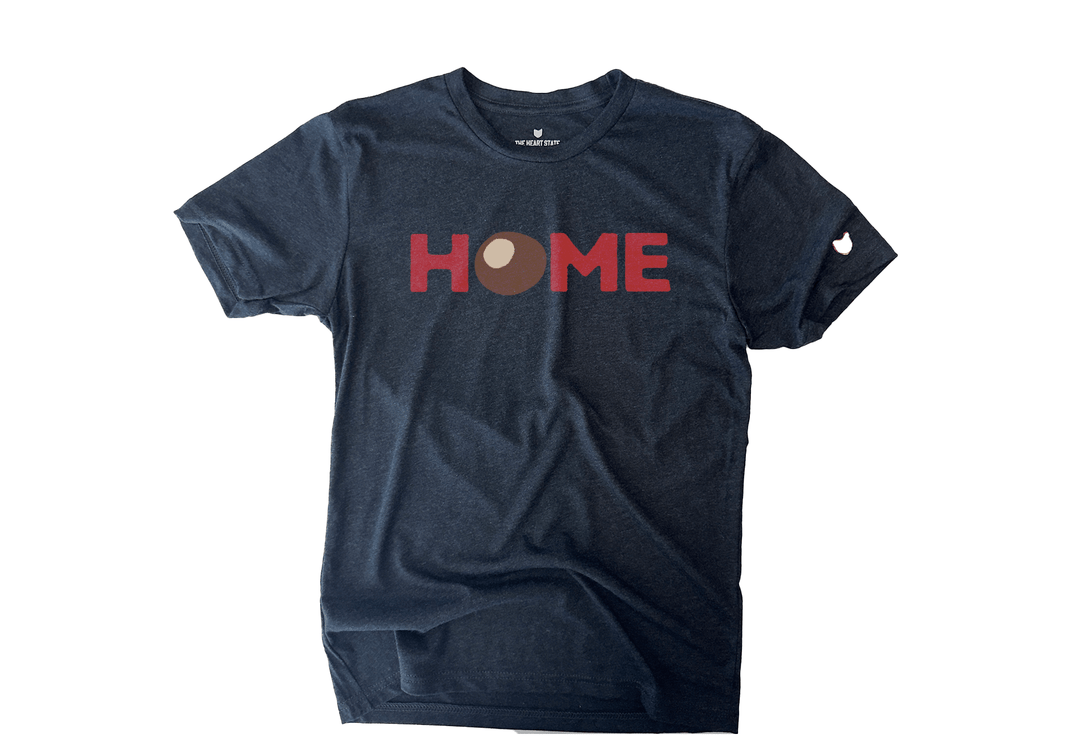 HOME T-shirt featuring a buckeye nut design as the ‘O’ by The Heart State