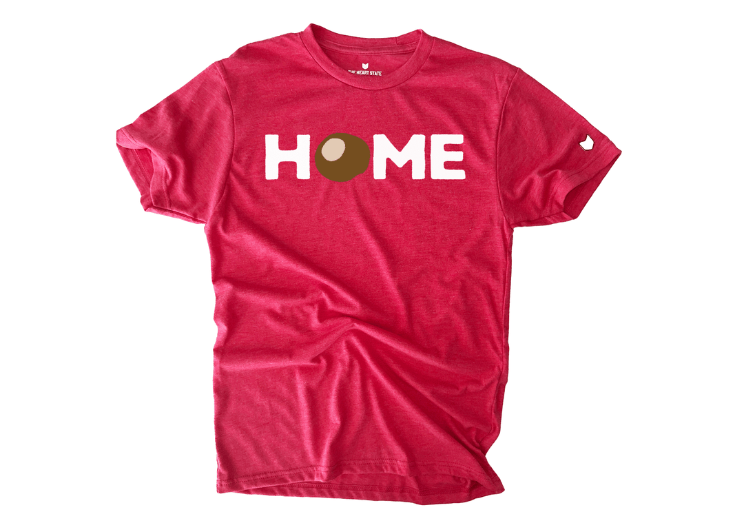 HOME T-shirt featuring a buckeye nut design as the ‘O’ by The Heart State